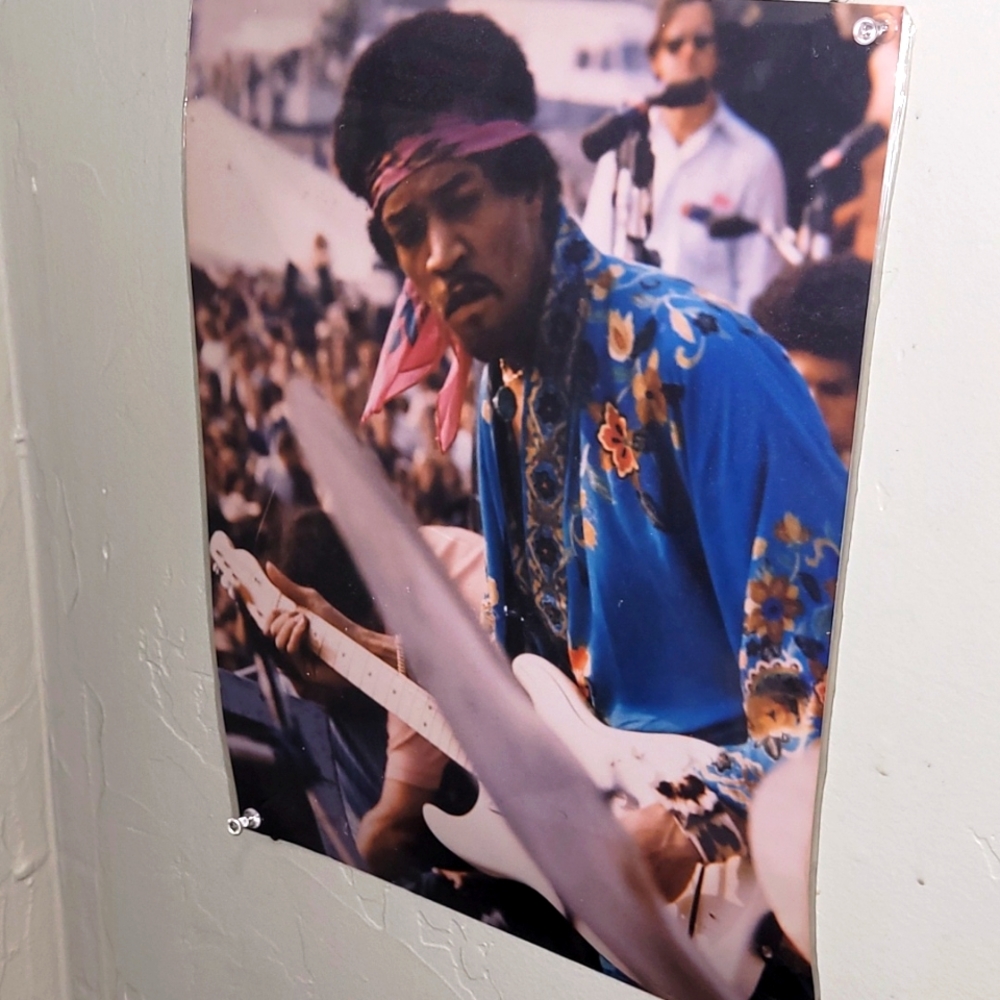 Real photo bought at Woodstock poster size of Jimmy Hendrix . ITS LAMINATED